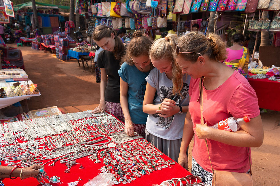 Compromise in action: I would never choose to spend entire days looking at cheap jewelry at a market. My kids love it. So, we do it