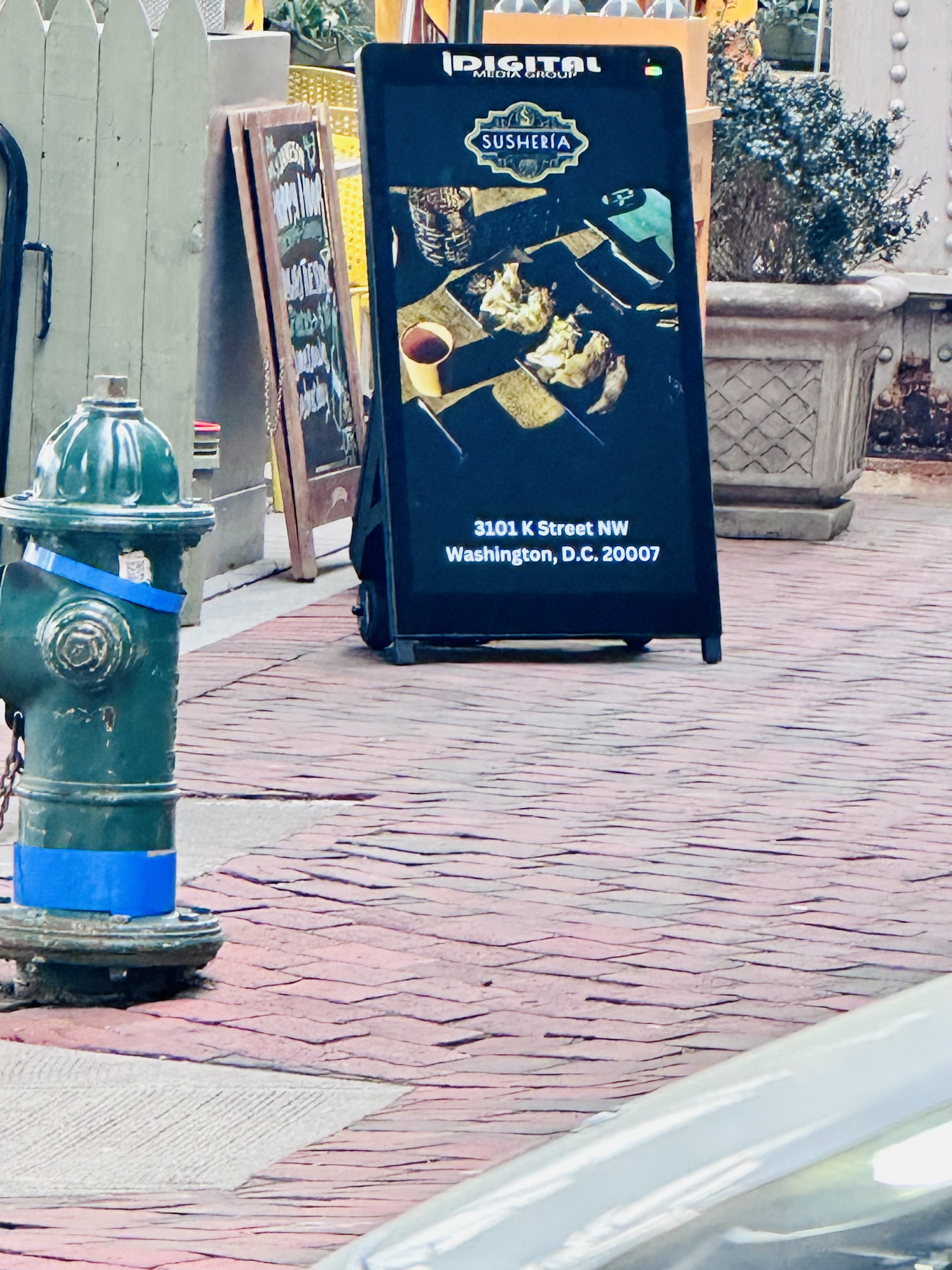 i-Frame digital poster on a city sidewalk