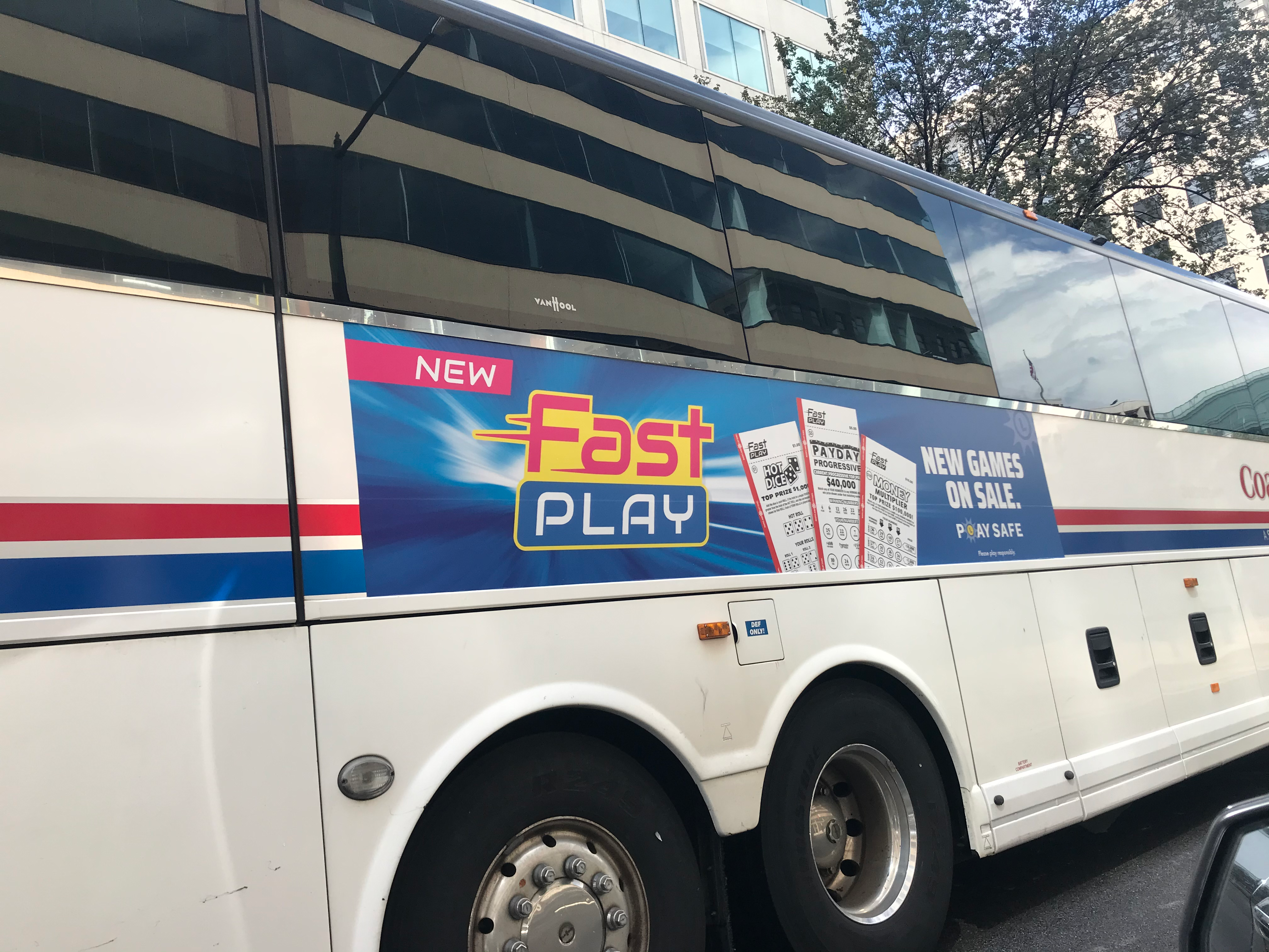 Commuter bus with a Maryland Lottery Fast Play ad
