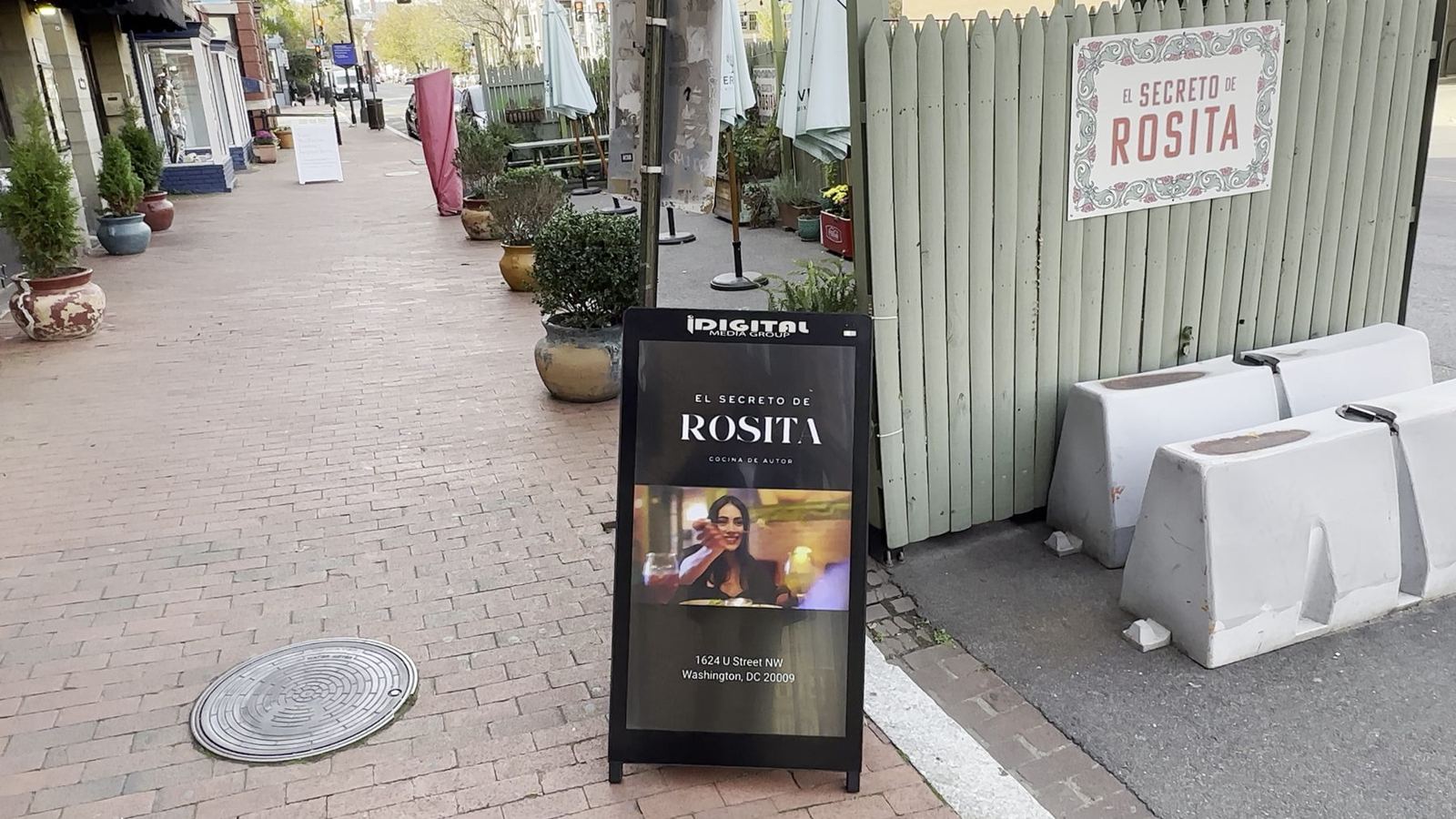i-Frame digital poster on a sidewalk outside a restaurant