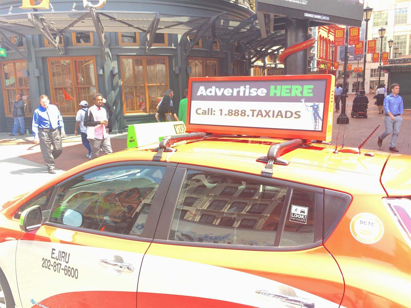 Taxi with an iDigital rooftop display at Gallery Place in Washington, DC