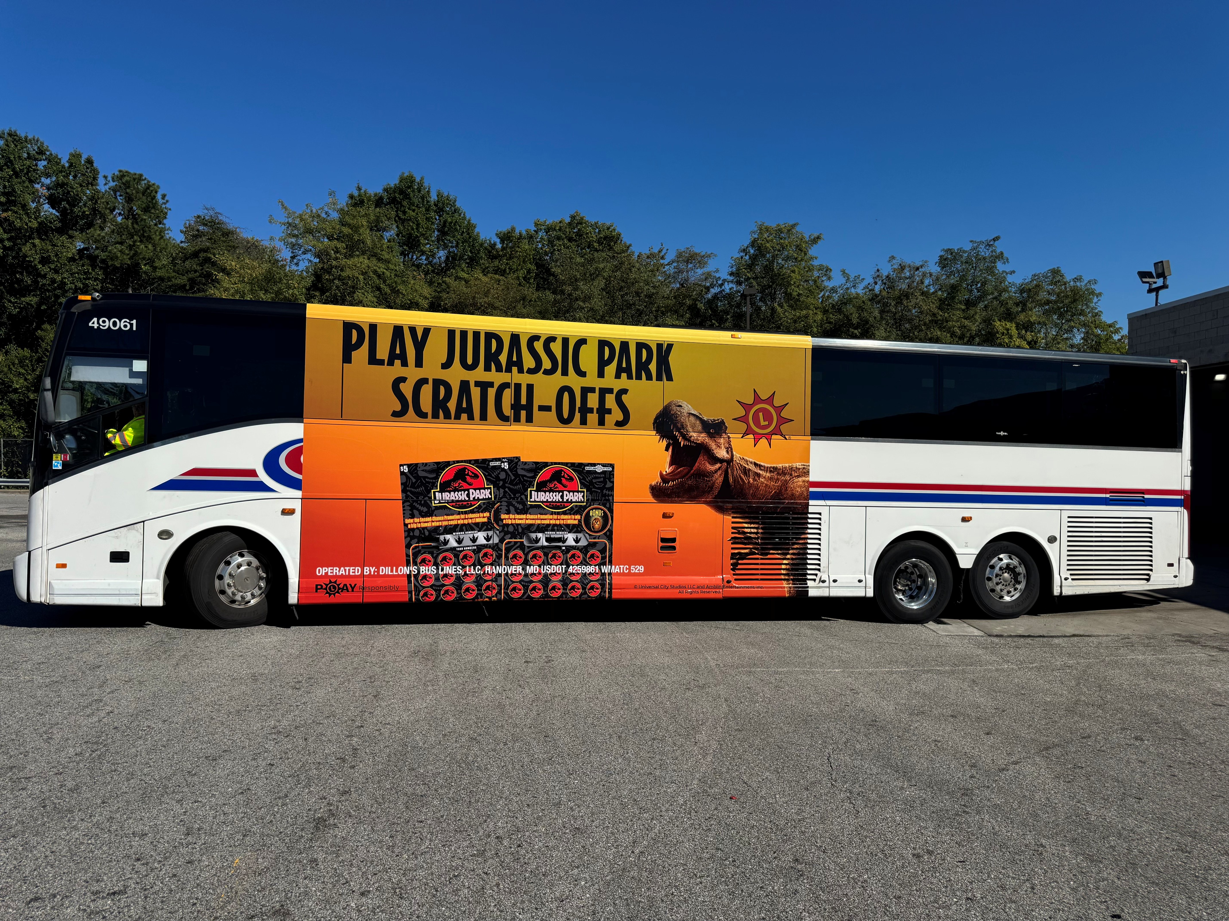Commuter bus with a Maryland Lottery Jurassic Park scratch-offs ad