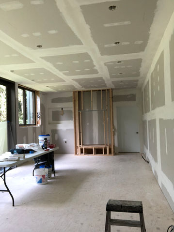 Living room ceilings before drywall repair and paint