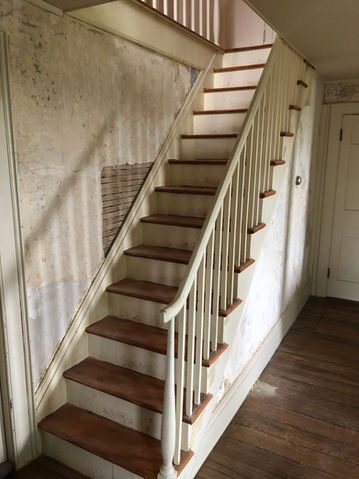 Staircase that has to be drywall repaired and painted