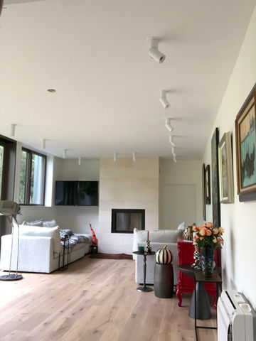 Living room drywall repaired and painted in Fairport NY