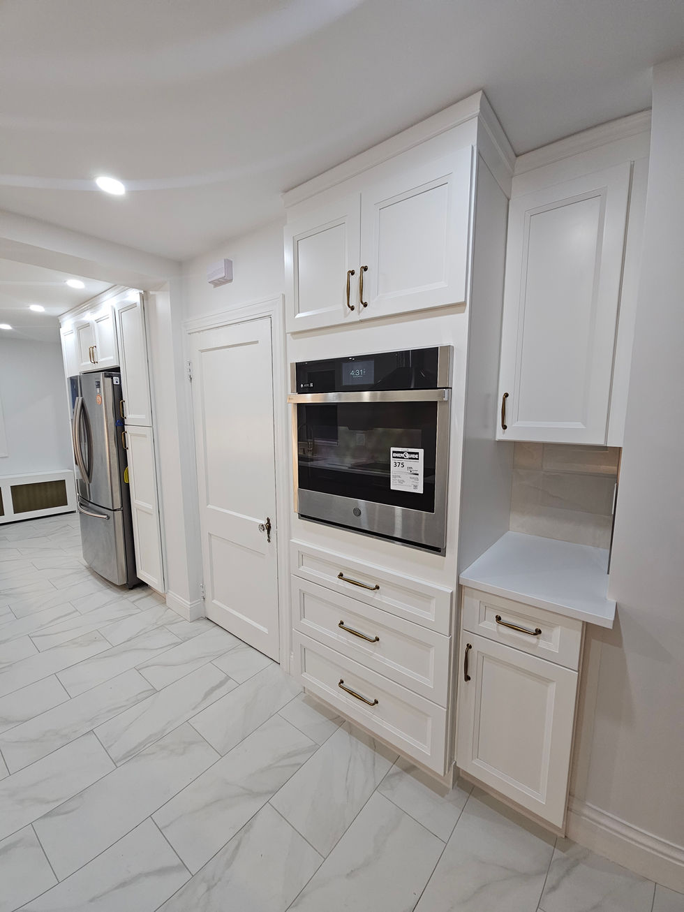 Finished Carpentry, Kitchen backsplash installation, flooring installation and  brand new stainless steel appliances. 
