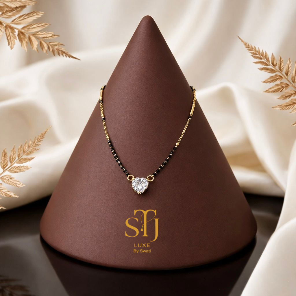 Gold and black bead necklace with heart diamond pendant