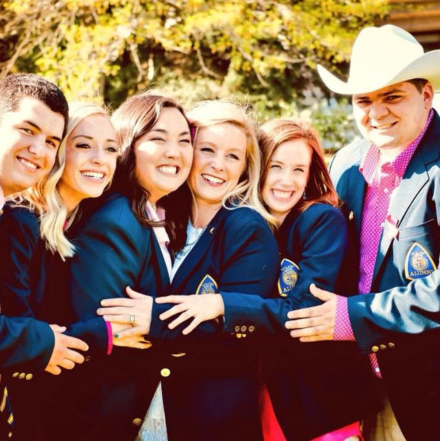 Group of smiling students in FFA corduroy jackets