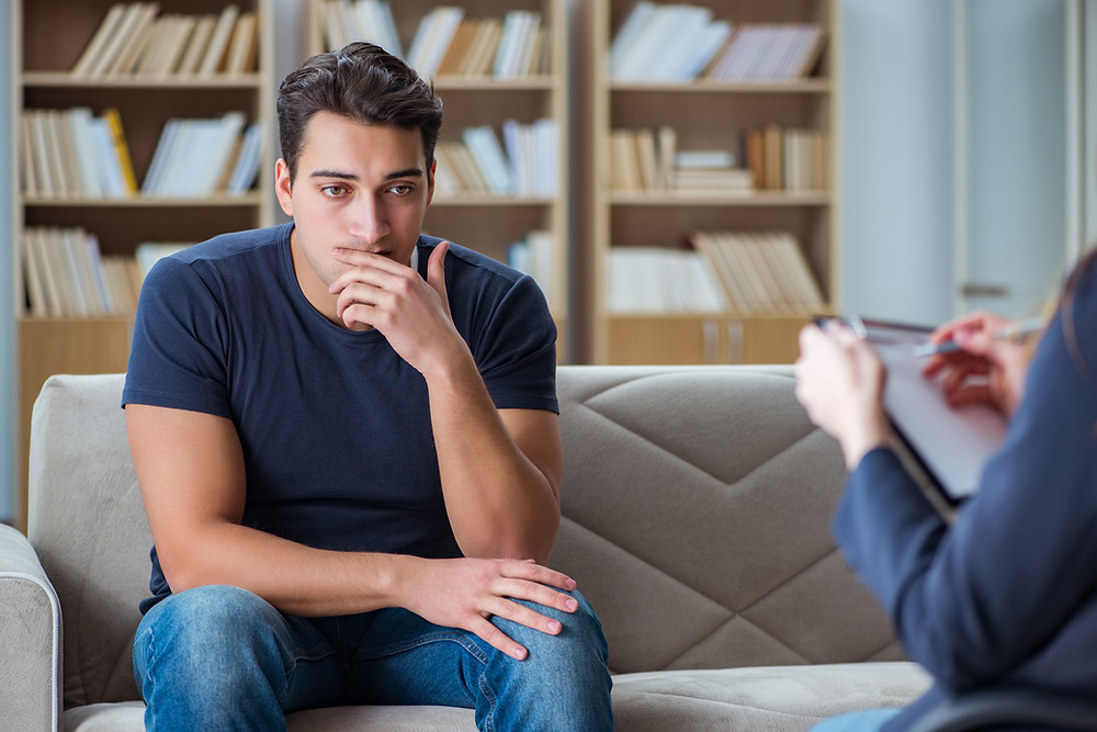 Man in a therapy or life coaching session in Kentucky. We also offer online life coaching and therapy.