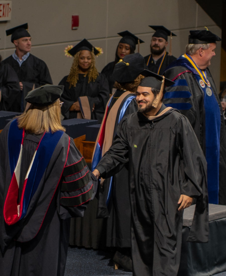 Graduates walking during a commencement ceremony
