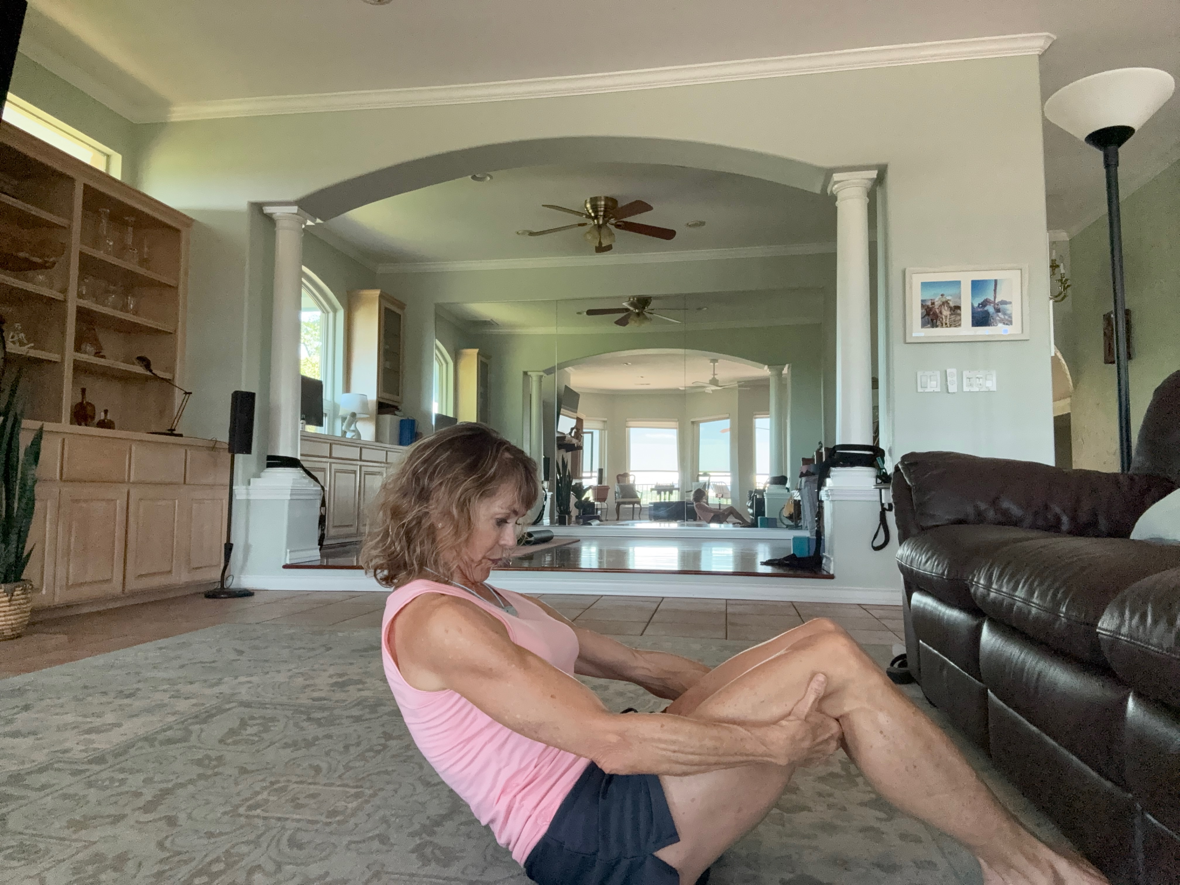 person practicing boat pose