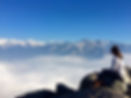 a scenic original photo of Sherri Huang sitting on Moro Rock in California and overlooking a cloud-covered valley, The Holistic SLP, theholisticslp.com, holistic speech therapy, holistic SLP, reiki, https://www.reiki.org/, https://www.asha.org/