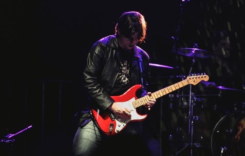 Miguel Machado playing Fender guitar.jpg