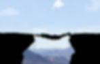 Man hanging between two rocks.