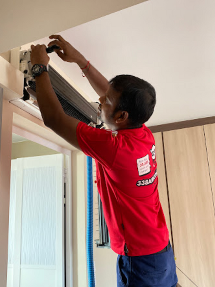 employee assembling aircon