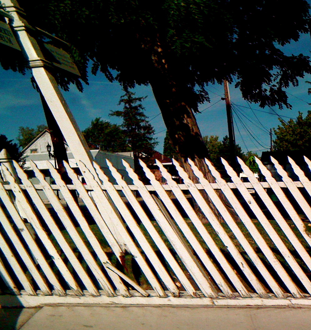 chipped/bent white fence