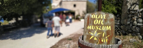 Road entrance to Olive Oil Museum with old olive press on Croatia island hopping walking tour