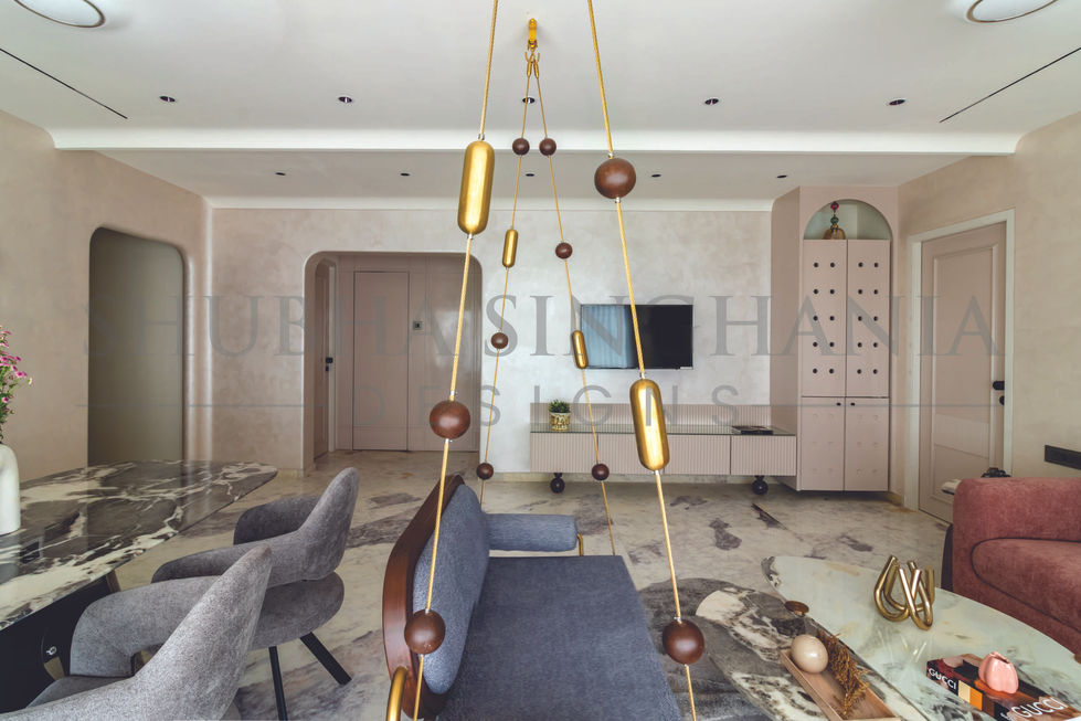 Modern living room with unique hanging decor elements.