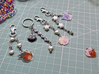 keychains made with heat shrink plastic of the characters from the movie Flow