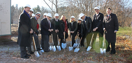 Laurel Adams and REDC Board of Directors with shovels at groundbreaking ceremony for REDC building