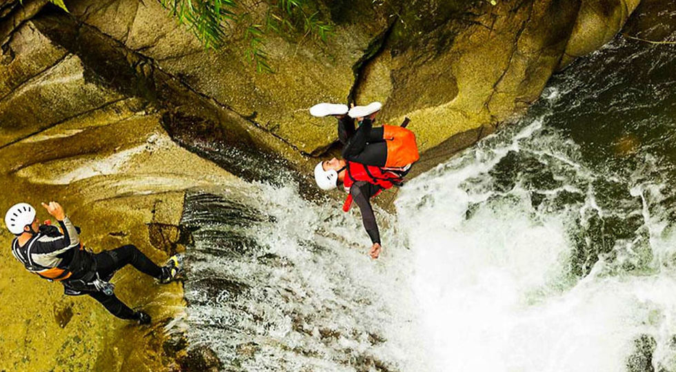 Cliff Jumping and Water Slides at Kawasan Falls is an adrenaline-filled adventure where visitors leap from natural rock ledges into clear turquoise pools and slide down smooth rock formations into the river.