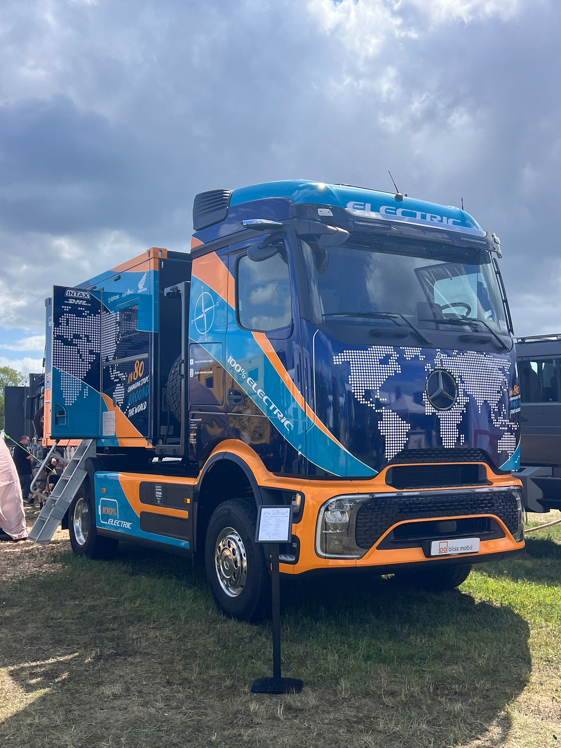 Orange and blue expedition vehicle on display at Abenteuer & Allrad