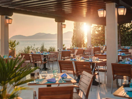 Sunset dining terrace with sea views at Sun Gardens Dubrovnik resort in Croatia.