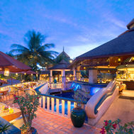 Poolside restaurant and bar at Mangosteen Resort Phuket during the evening