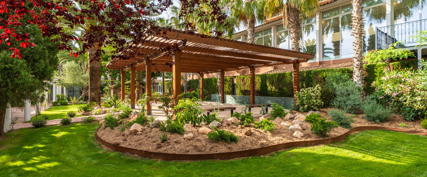 Peaceful garden pavilion at Palasiet Thalasso Clinic wellness retreat in Spain.
