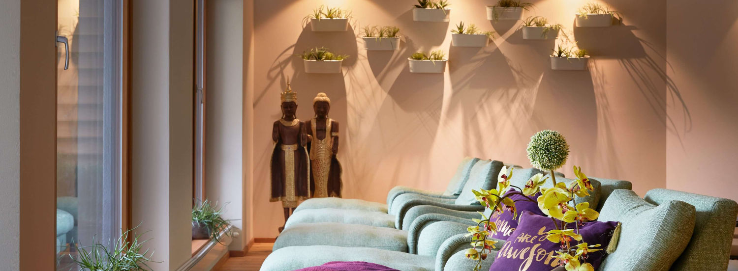 Indoor relaxation lounge with cosy seating at Ayurveda Resort Mandira Austria