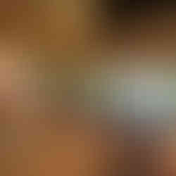 Villa sitting area with natural light, tropical views, and access to a private balcony at Kamalaya.