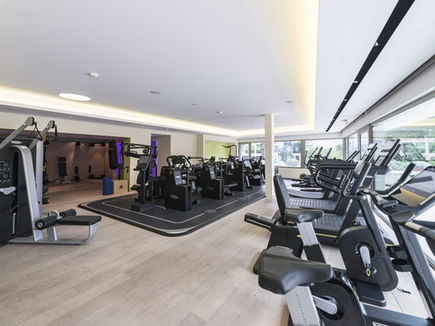 Gym at Clinique La Prairie with cardio and strength equipment