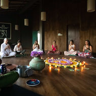 Group meditation class inside Sen Wellness Sanctuary’s wooden shala