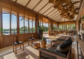 Modern relaxation lounge with calming interiors, a holistic setting for a women's health retreat in Bangkok.