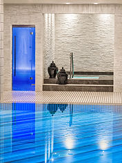 Spa with steam bath and pool area at Villa Eden Merano