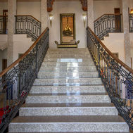 Marble staircase and wrought iron balustrade in the atrium