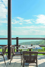 Outdoor dining terrace with views over Lake Garda at Lefay Resort