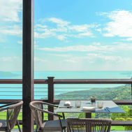 Outdoor dining terrace with lake views at Lefay Resort, Lake Garda