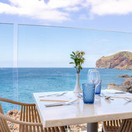 Dining terrace with Atlantic Ocean views at Galo Resort Madeira