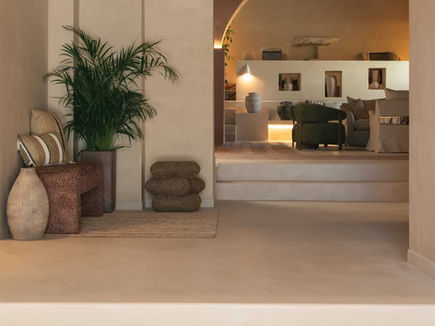 Entrance and reception at Shanti-Som Algarve, with herringbone brick flooring and soft natural light