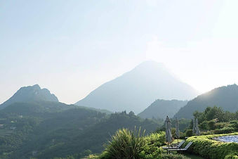 Scenic view of the mountains and infinity pool at Lefay Resort Lago di Garda