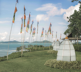 Flags and spiritual ambience at Kamalaya’s coastal sanctuary