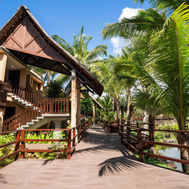 Timber walkway leading past the guest suites at Shanti Maurice