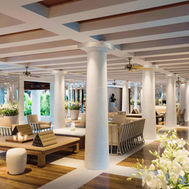 Stylish and airy Orchid Lounge with white interiors and fresh orchids at Chiva-Som