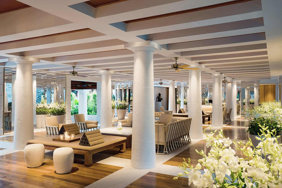 Stylish and airy Orchid Lounge with white interiors and fresh orchids at Chiva-Som