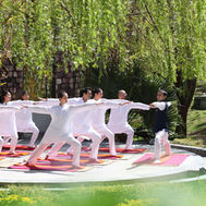 Morning yoga session in the gardens at Ananda in the Himalayas