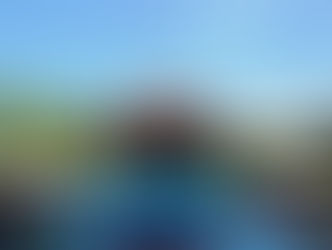 Tranquil outdoor pool with tropical plants, sun loungers, and a traditional Thai pavilion at Phuket Cleanse, Thailand.