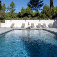 Outdoor pool and sun loungers at MasQi, The Energy House