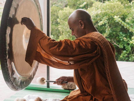Visiting Buddhist monk performing gong healing at Sen Wellness Sanctuary Sri Lanka