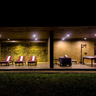 Treatment beds in an open-sided pavilion at night, Santani Wellness Resort